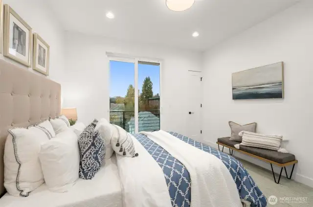 Your retreat awaits! This chic bedroom combines comfort and sophistication with contemporary design and picturesque window views.