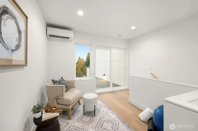 The ultimate entertainment zone awaits! This space features a wet bar and leads seamlessly to a private rooftop deck, perfect for sunsets and city views.