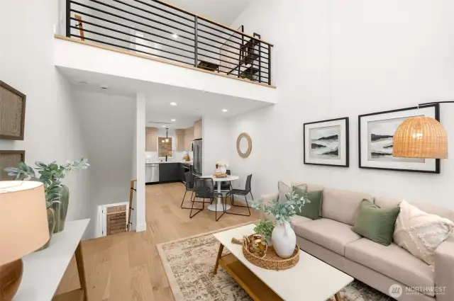A chic open-concept kitchen and living area combine functionality and style, featuring modern finishes and premium appliances.