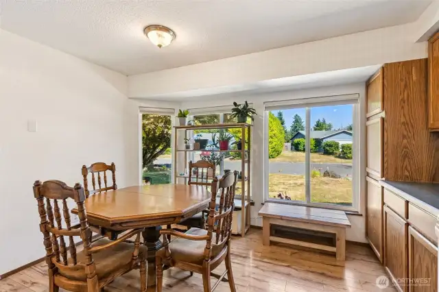 Lots of windows bring in the natural light for a cheery kitchen and eating space.