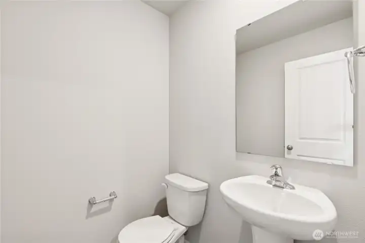 Powder bath on main floor.  Pictures are for representational purposes only. Materials and colors may vary,