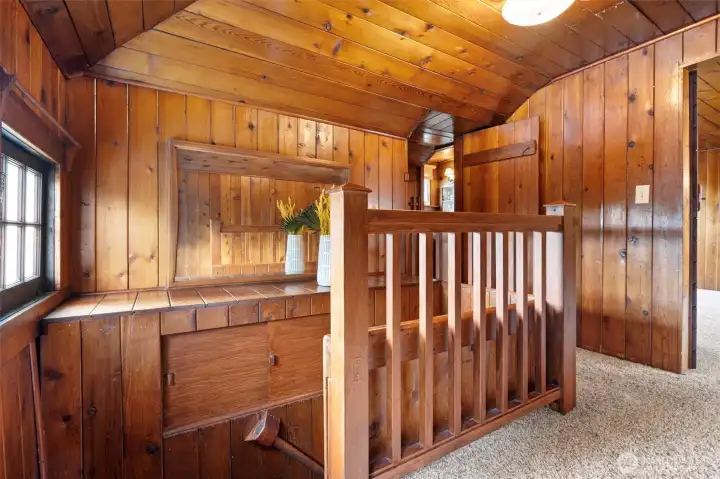 Upstairs landing with knotty pine paneling