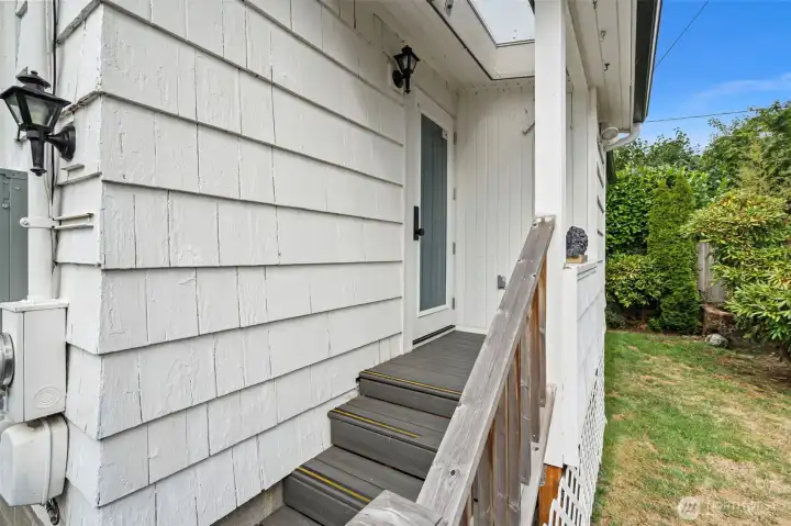 Door off kitchen leads to the fully fenced back yard
