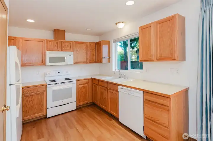 Well appointed kitchen with updated laminate floors