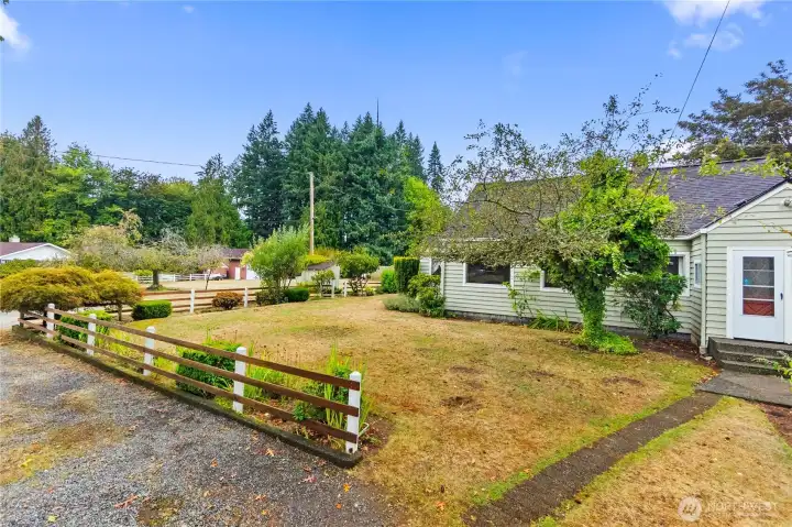 There's front door on the right, and side access on the left.