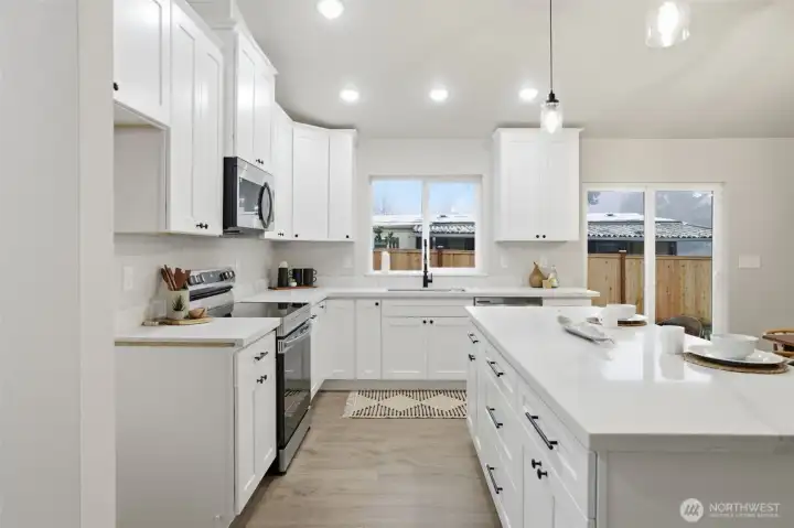 Bright kitchen with ample cabinetry and generous prep space