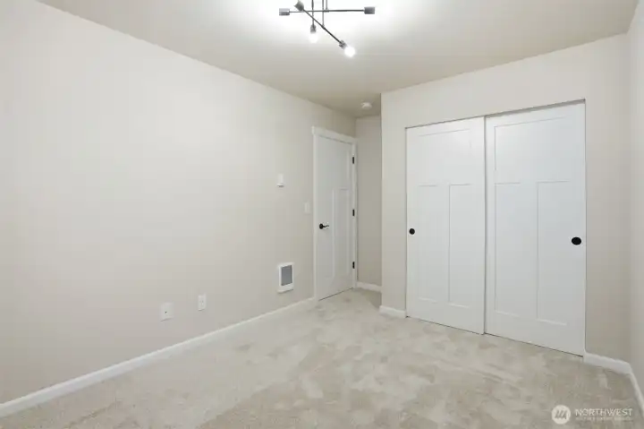 Second bedroom with plush carpet and comfortable layout