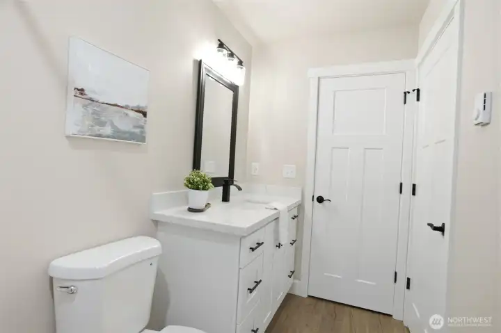 Hallway bathroom with ample space and modern touches