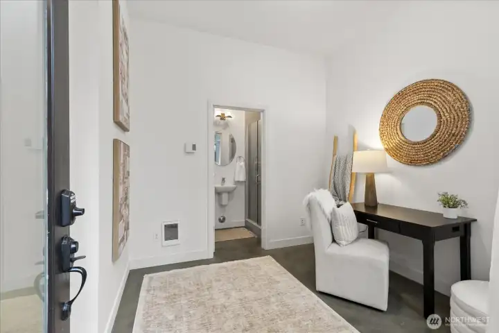 First floor living, with polished concrete surface, offers flex space for office, gym or additional storage for paddle boards, bikes, skis, etc.