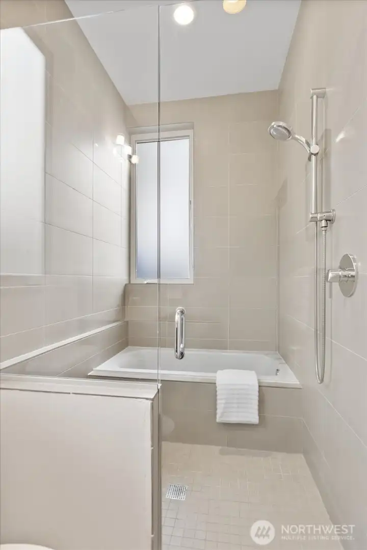Second floor full bathroom, w/ oversized shower/bath combo, is the perfect place to enjoy a spa like experience at home.