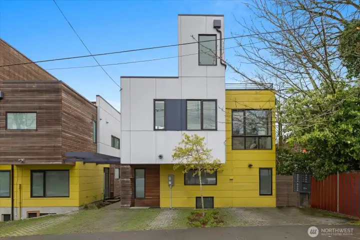 Each unit in this development has 1 designated parking spot.  Parking for this unit would be farthest to the right, adjacent to the mail box stand.