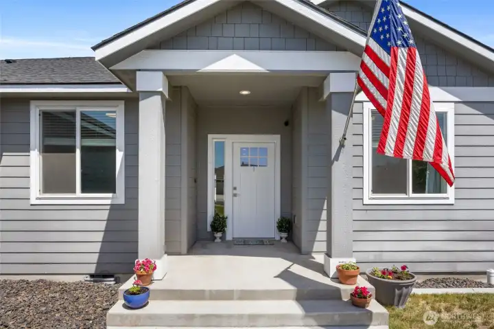 Spacious welcoming front porch entry.