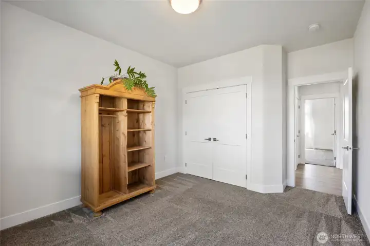 Bedroom 2 (back of house) closet has built-in shelving