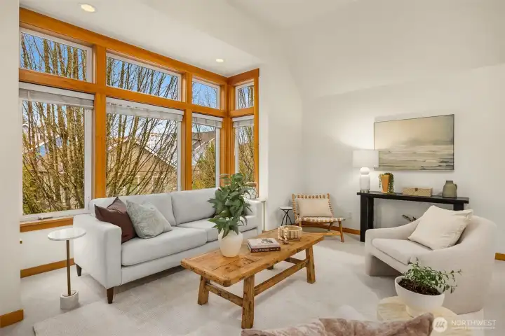 Vaulted ceilings in the living room bring in beautiful natural light.