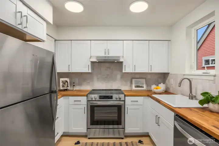 Fully remodeled kitchen in 2026! NEW cabinetry, butcher block counters, lighting, flooring and stainless steel appliances.