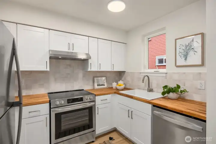 Enjoy cooking and entertaining in this beautifully updated, fully equipped kitchen.