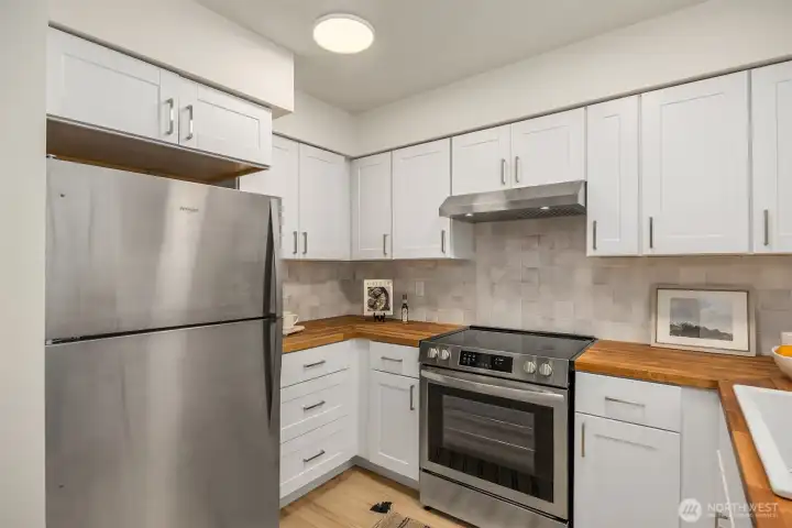 Cook and entertain in a remodeled kitchen with warm woods and stylish tile.