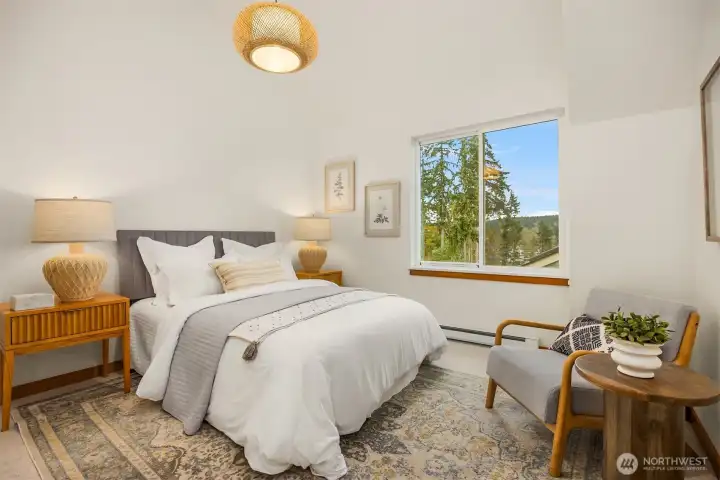 Enjoy natural light and a lovely view from one of the two bedrooms.