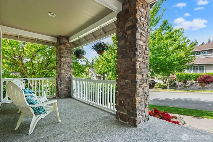 Front porth with gate to the side. Professionaly landscaped yard