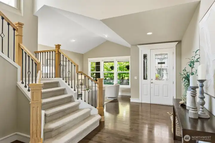 Entry with spacious foyer and gathering room off to the right.