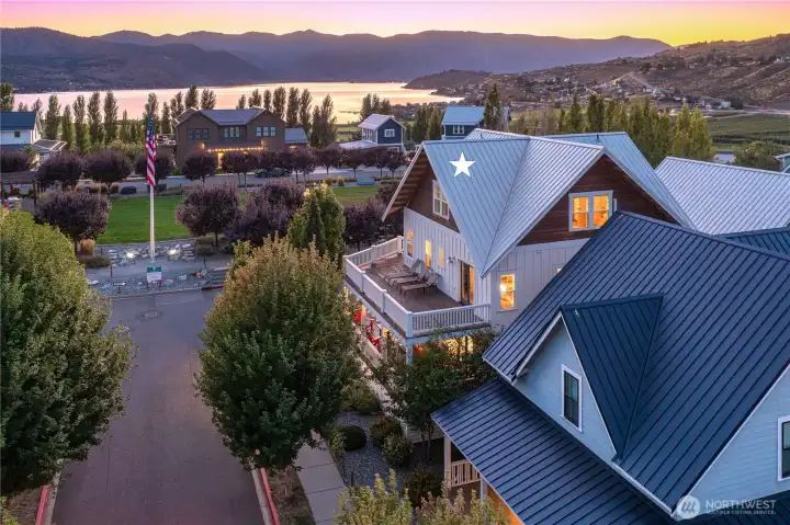 Aerial twilight view of west facing home overlooking the Lookout's Hilltop Park and Lake Chelan.
