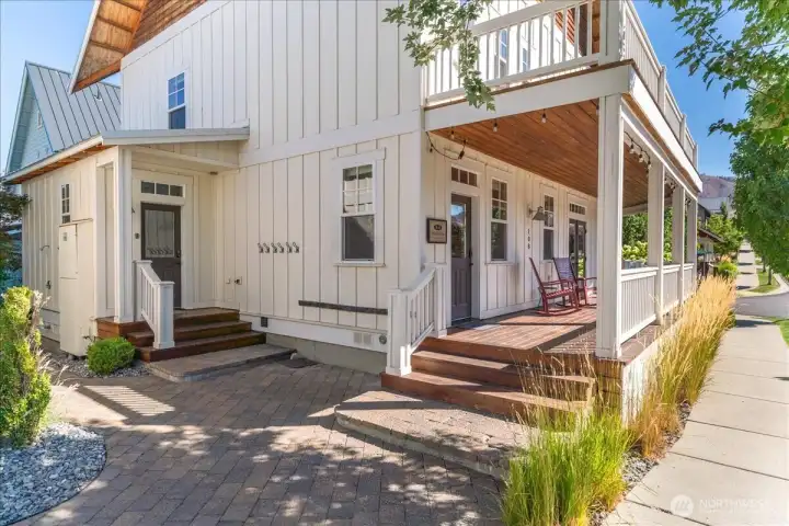 Exterior view of home with wraparound porch and main entry and 2nd entry to mud room/utility room.