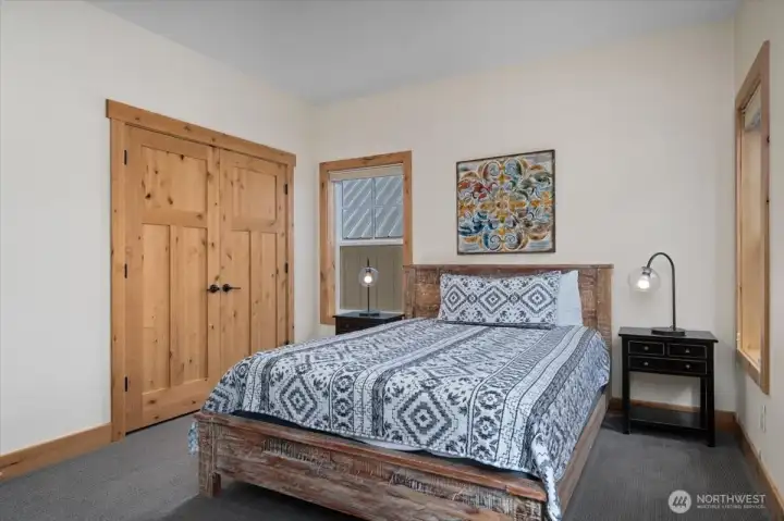 Upper level queen guest bedroom.