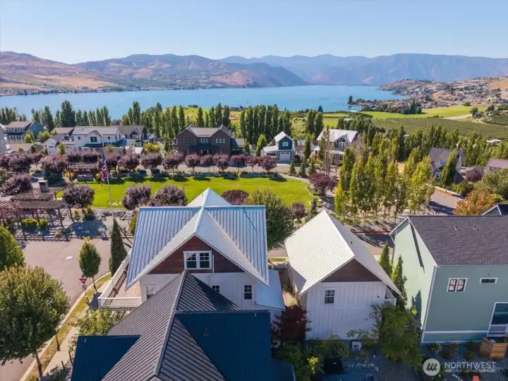 Aerial view of home looking west over the Lookout's Hilltop Park and Lake Chelan.