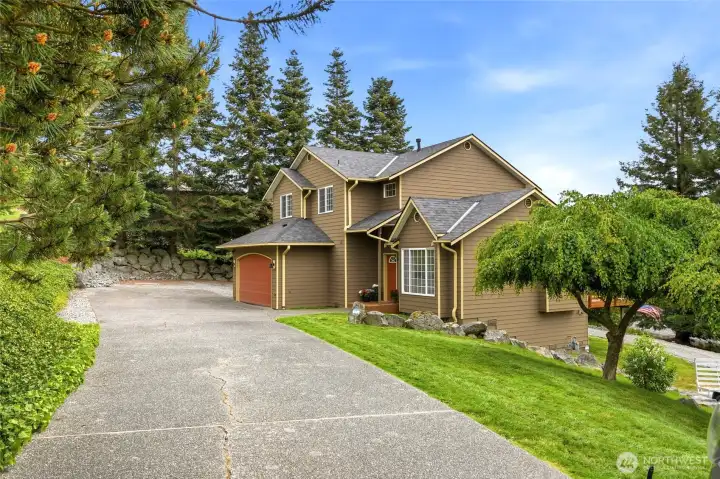A long driveway and beautifully maintained grounds create a serene first impression. A long driveway and beautifully maintained grounds create a serene first impression.
