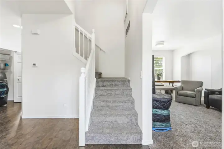 A light and bright entry is highlighted by soaring ceilings, updated flooring, and a clean, cohesive feel throughout. A light and bright entry is highlighted by soaring ceilings, updated flooring, and a clean, cohesive feel throughout.