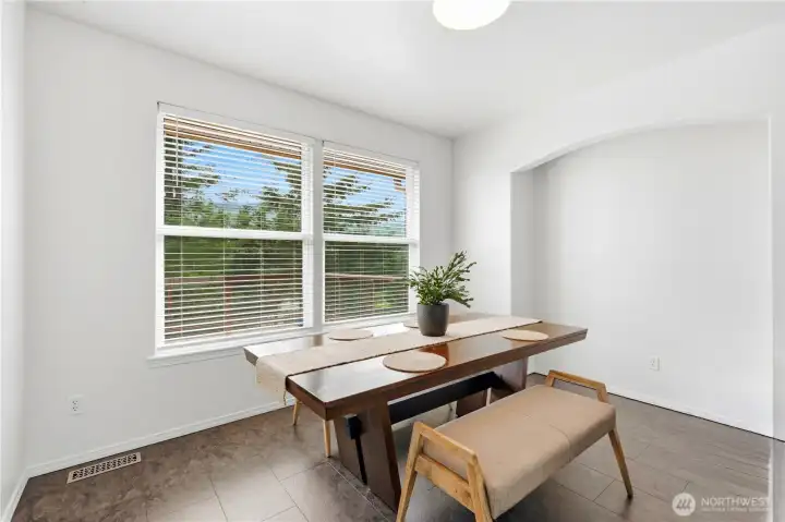 The dining area is a comfortable gathering space with easy access to both the kitchen and living areas. The dining area is a comfortable gathering space with easy access to both the kitchen and living areas.