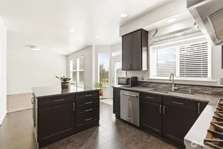 Thoughtfully designed, the oversized island adds both functionality and a welcoming focal point to the kitchen. Thoughtfully designed, the oversized island adds both functionality and a welcoming focal point to the kitchen.