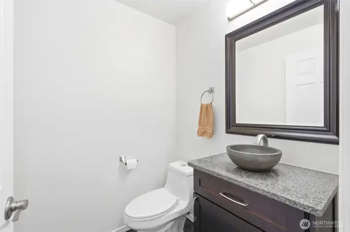The main-floor half bath adds convenience and functionality to the home’s layout. The main-floor half bath adds convenience and functionality to the home’s layout.