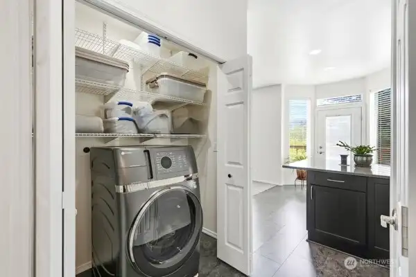 Convenient main-level laundry area with additional storage and easy access to the main living spaces. Convenient main-level laundry area with additional storage and easy access to the main living spaces.