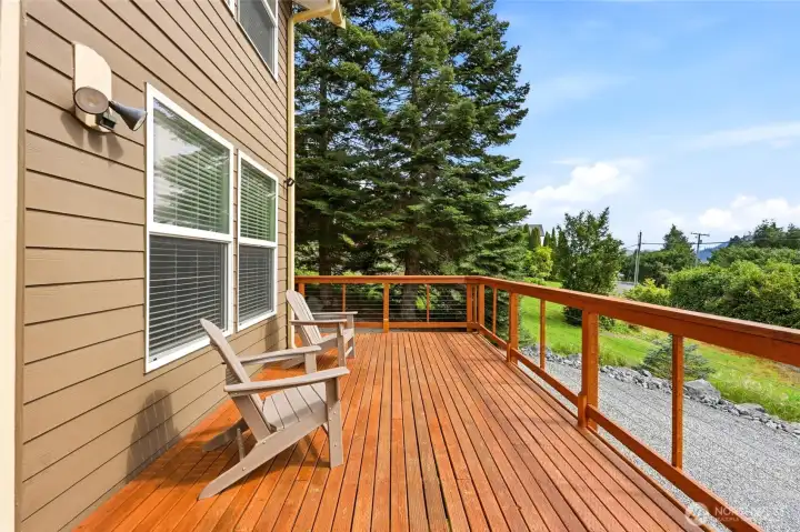 The expansive deck creates a natural extension of the home with multiple spaces for dining, relax ng, and entertaining. The expansive deck creates a natural extension of the home with multiple spaces for dining, relax ng, and entertaining.