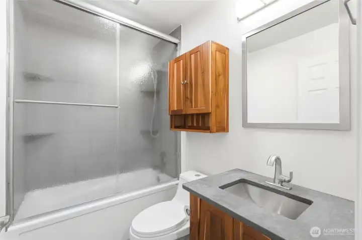 The upper-level full bath features updated finishes and serves the secondary bedrooms with both style and functionality. The upper-level full bath features updated finishes and serves the secondary bedrooms with both style and functionality.