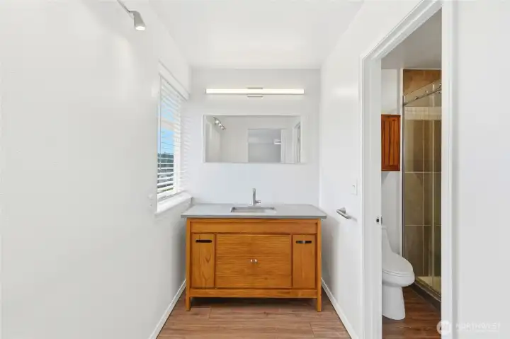A separate vanity area has abundant natural light and privacy. A separate vanity area has abundant natural light and privacy.