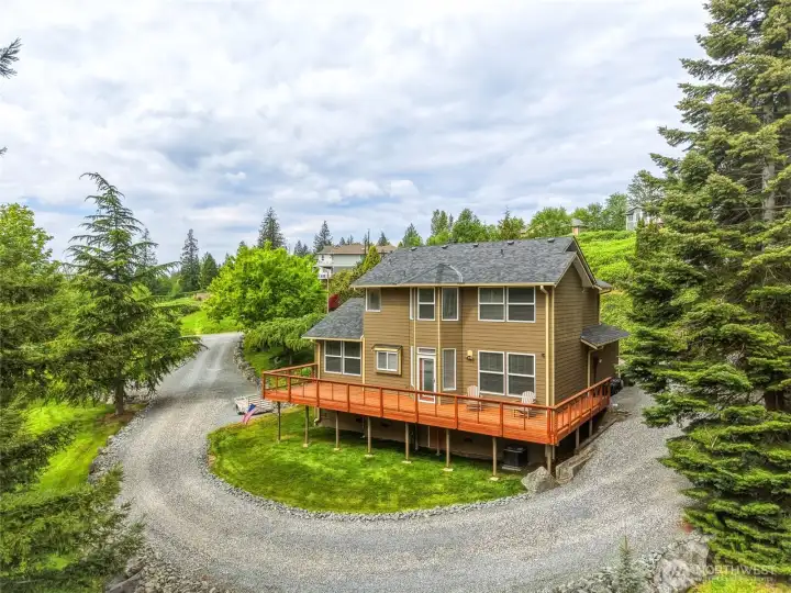 A circular-style driveway creates a welcoming approach with easy in-and-out access. A circular-style driveway creates a welcoming approach with easy in-and-out access.