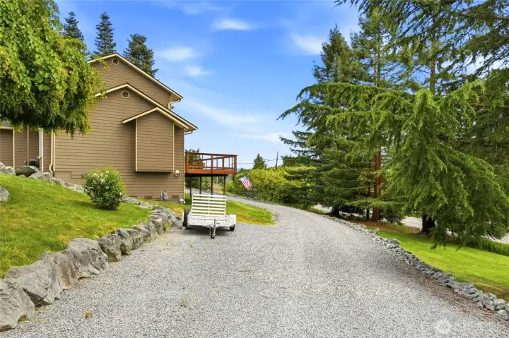 Long driveway and spacious lot provide additional parking and a sense of privacy and separation. Long driveway and spacious lot provide additional parking and a sense of privacy and separation.