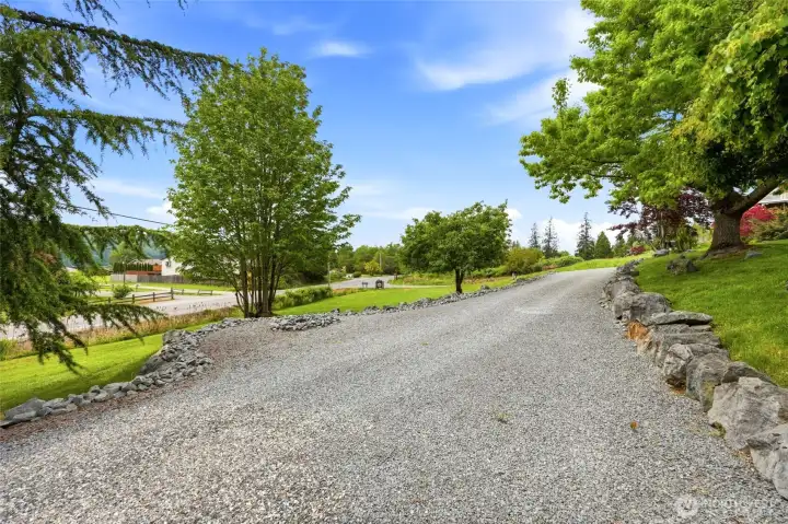 Mature landscaping, manicured lawn areas, and a generous driveway create a clean and inviting outdoor setting. Mature landscaping, manicured lawn areas, and a generous driveway create a clean and inviting outdoor setting.
