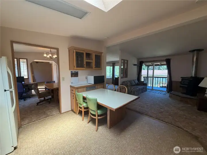 View from kitchen to dining room on left and living room on the right. View from kitchen to dining room on left and living room on the right.
