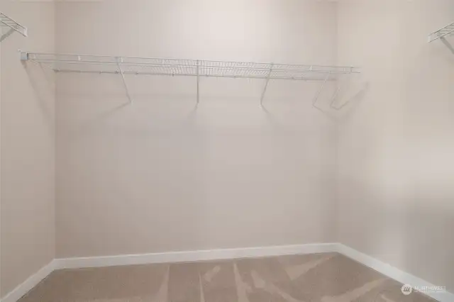 Walk-in closet off of primary bedroom