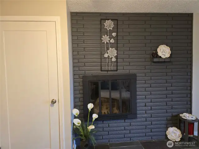 Fireplace in primary bedroom.