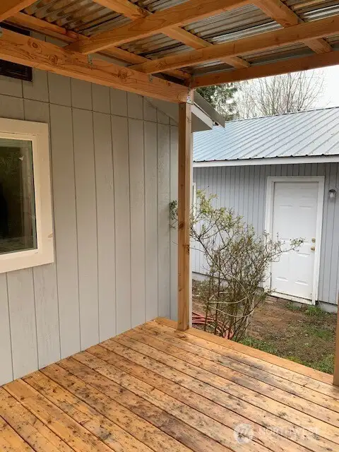 Covered deck outside the primary bedroom.