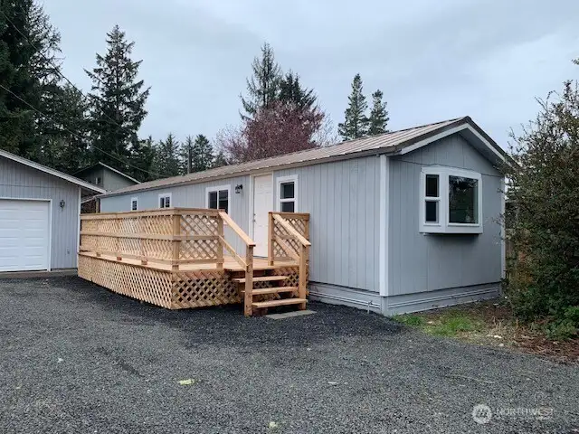 Brand new deck with treated knotty pine big enough for an umbrella table and chairs.