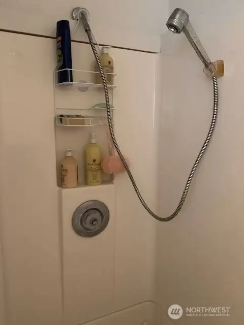 Shower in the bathroom at the back of the garage.