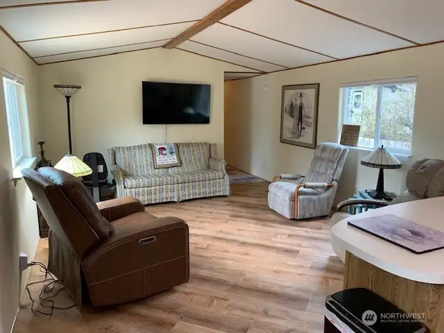 Come into the light and bright living room and enjoy the beautiful new wood vinyl floors.