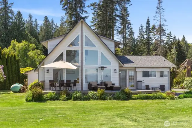 Impeccable floor to ceiling windows & multiple level decks