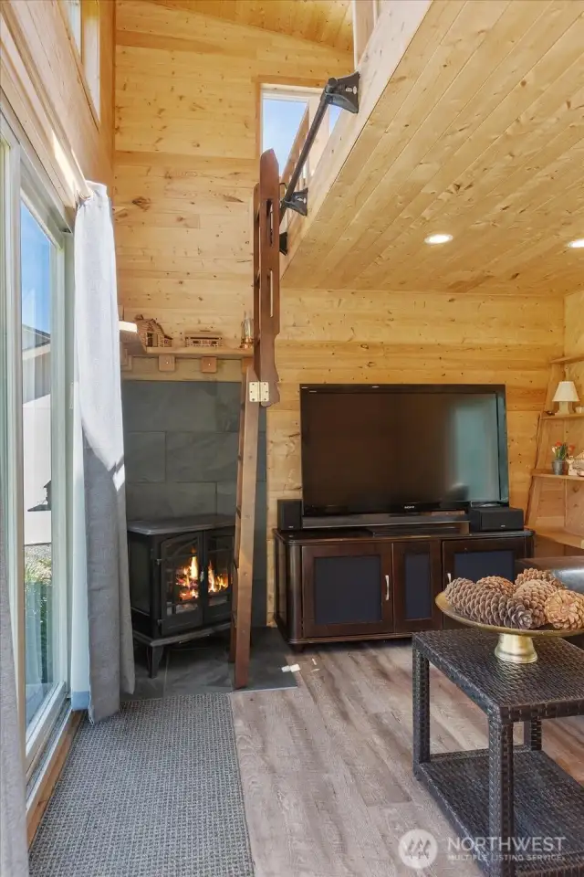 Lower floor of guest cabin w/ladder to loft