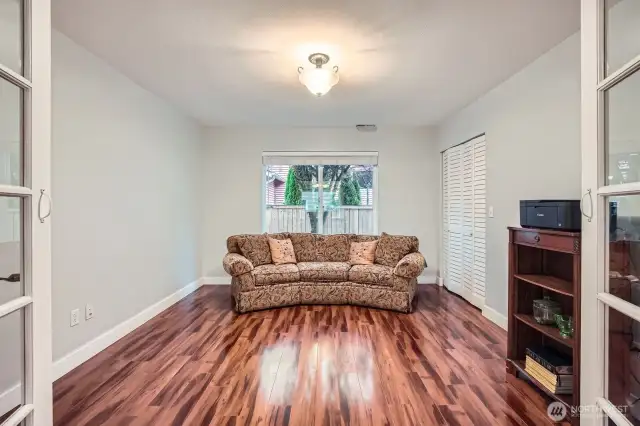 bedroom on main floor between garage entrance and stairs